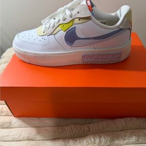 Nike White Sneakers with Blue and Yellow Accents